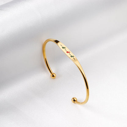 Hard bracelet with oil-drip pattern on gold-colored surface asonjewelry
