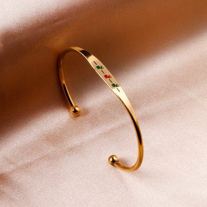 Hard bracelet with oil-drip pattern on gold-colored surface asonjewelry
