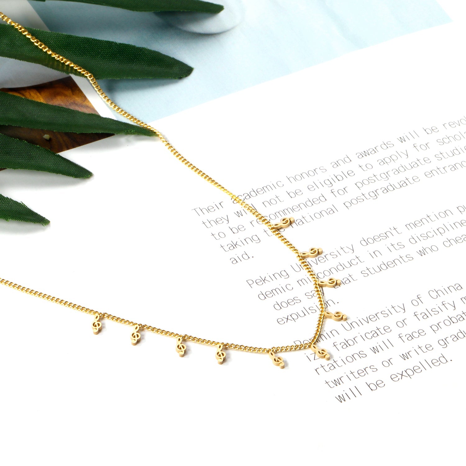 0.4 Side chain 40+5cm welded 10 necklaces with 2.5x5mm musical notes in polished finish. asonjewelry