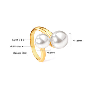 Two large and two small pearls in open pearl setting ring