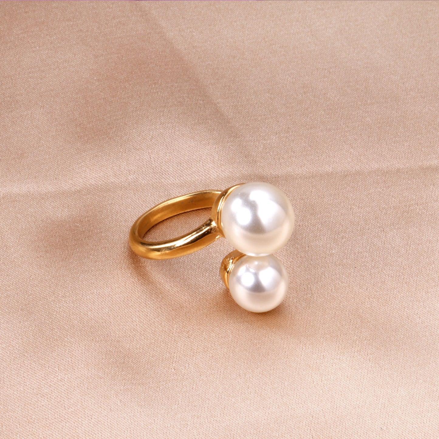 Two large and two small pearls in open pearl setting ring asonjewelry
