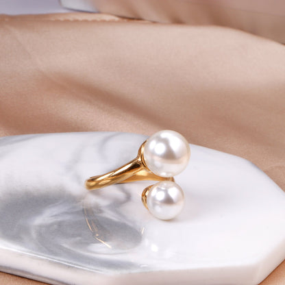 Two large and two small pearls in open pearl setting ring asonjewelry