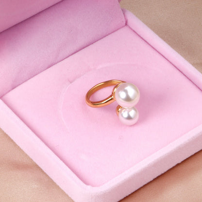 Two large and two small pearls in open pearl setting ring asonjewelry