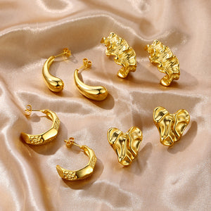 C-shaped earrings with irregularly shaped hammered out surfaces