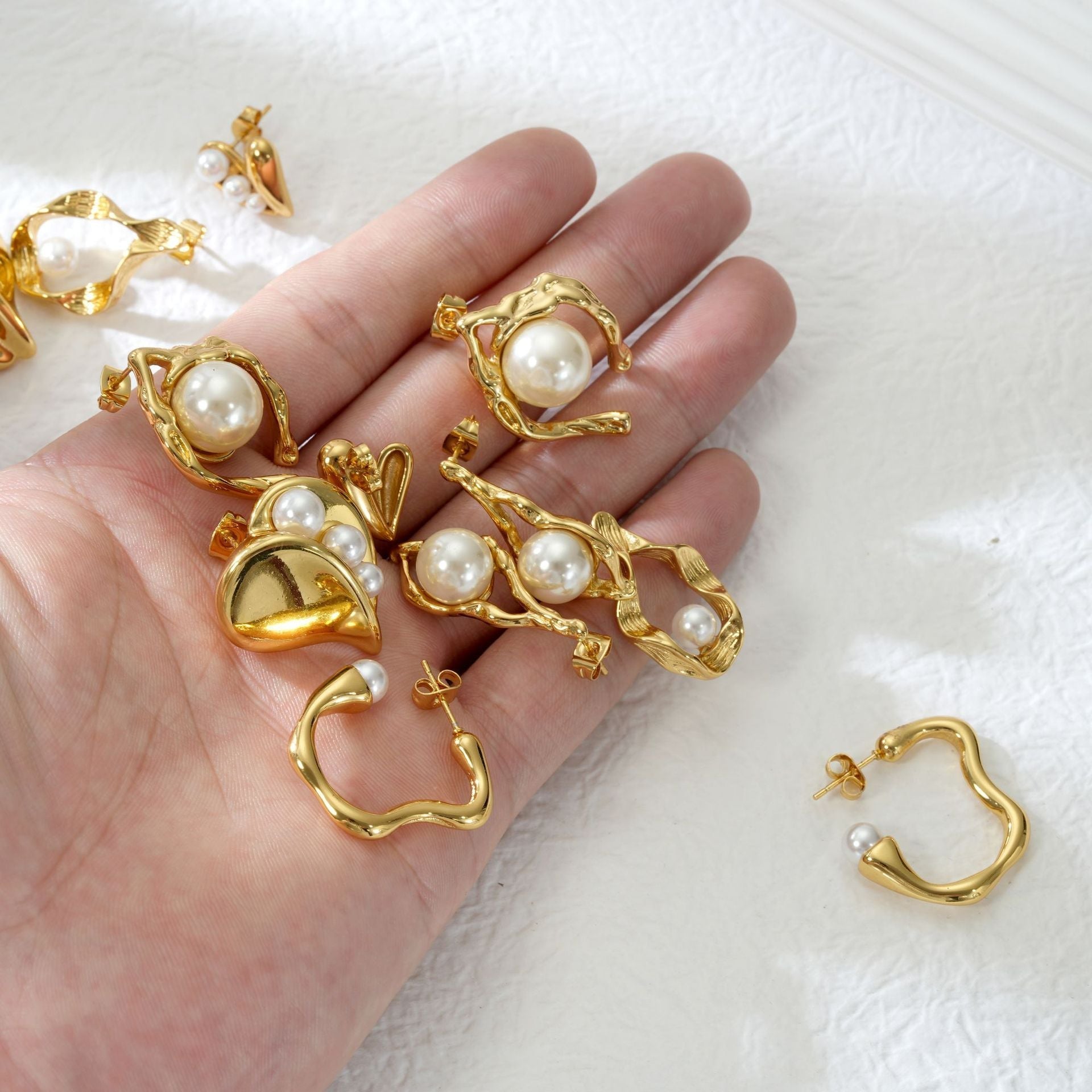 Wispy interior pearl-set heart-shaped stainless steel earrings asonjewelry