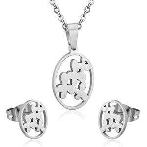 Steel/golden cut jewelry set with grass-like shape in the center without diamonds
