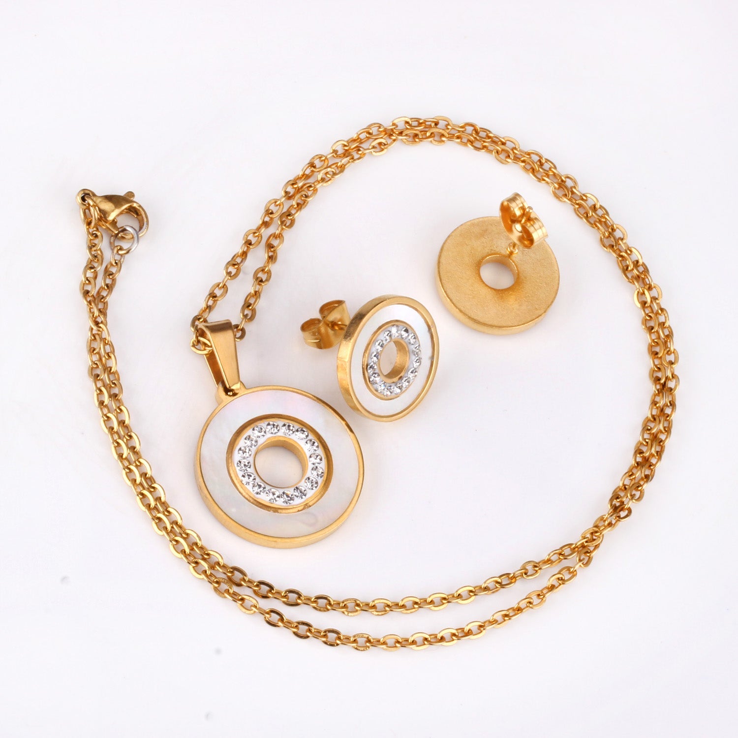 Gold/steel color white shells set with diamonds on top of circle with diamonds jewelry set asonjewelry