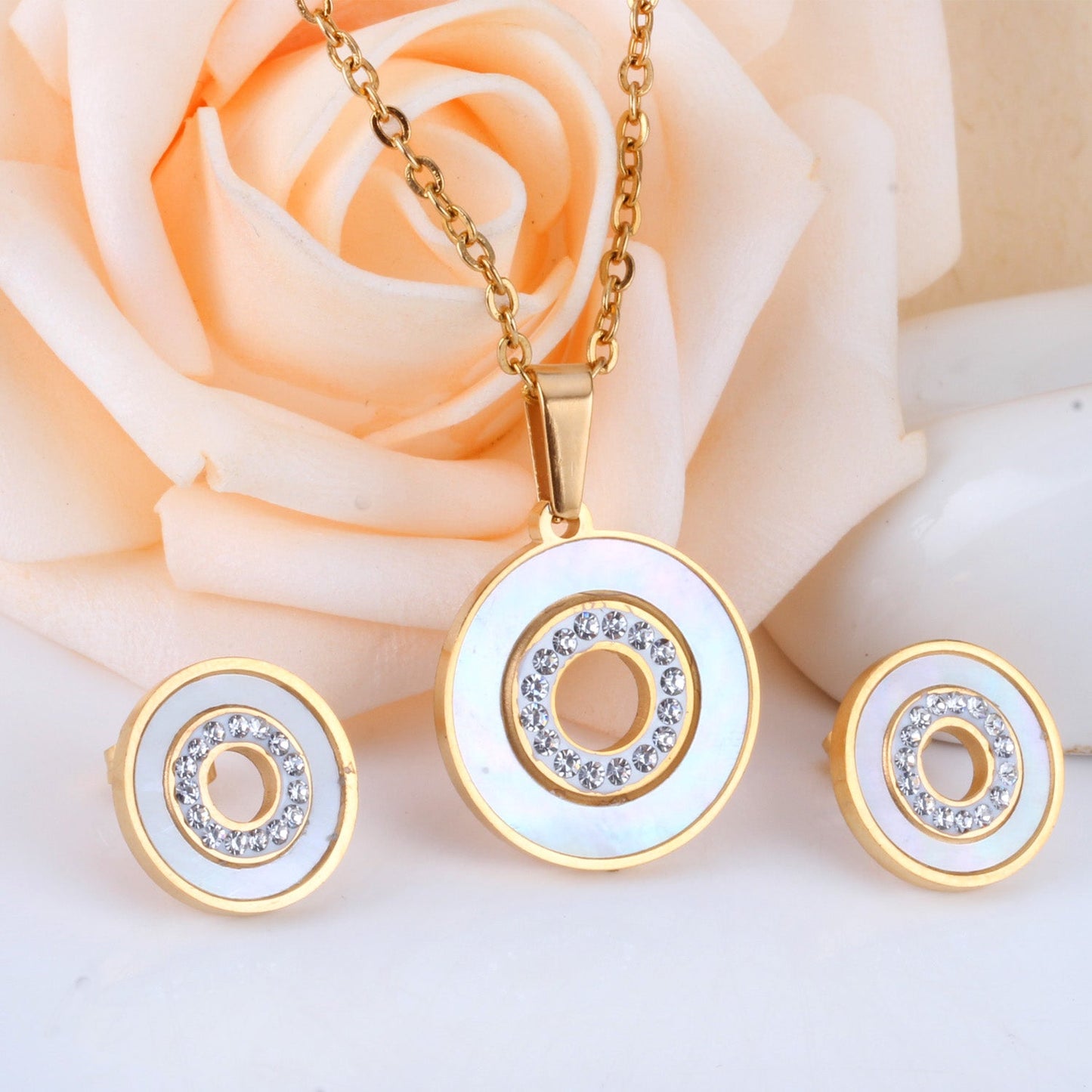 Gold/steel color white shells set with diamonds on top of circle with diamonds jewelry set asonjewelry