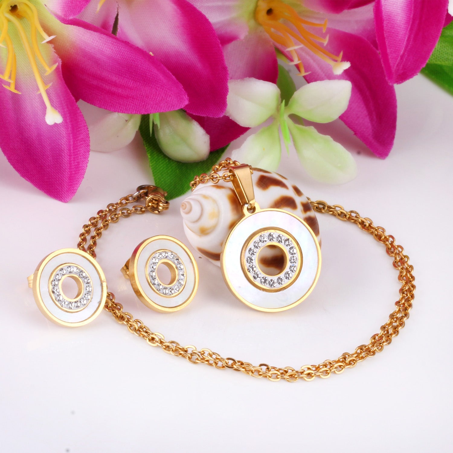 Gold/steel color white shells set with diamonds on top of circle with diamonds jewelry set asonjewelry