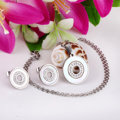 Gold/steel color white shells set with diamonds on top of circle with diamonds jewelry set asonjewelry