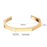 Three colors of black gold-tone steel with an angular face on an open-end rigid bracelet.