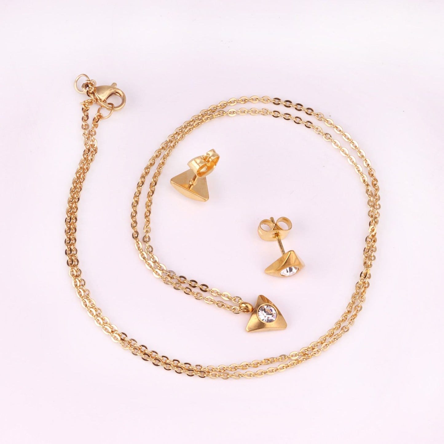 Gold/steel triangle jewelry set with diamond in the center asonjewelry