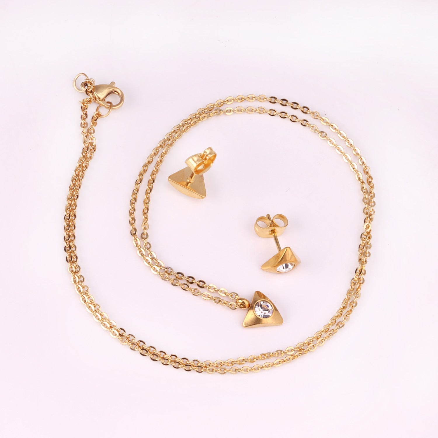 Gold/steel triangle jewelry set with diamond in the center asonjewelry