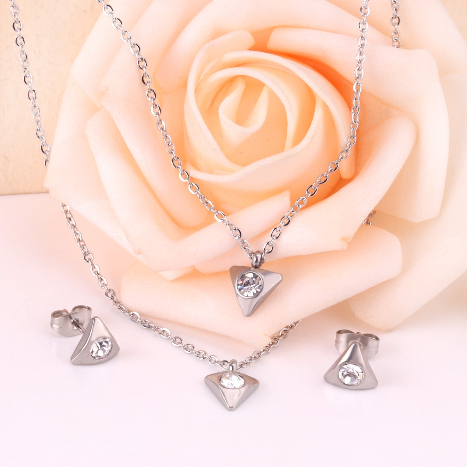 Gold/steel triangle double chain pendant set with diamond in the middle asonjewelry