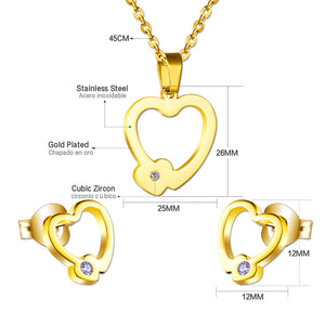 Set of cut jewelry in the shape of a heart x 2 + a small heart with diamonds on the upper door in gold/steel-colored wisps with a glossy finish