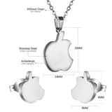 Set of jewels in gold/steel with a smooth surface of an apple with a bite.