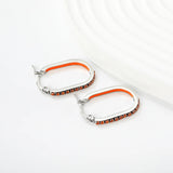 2.26 * 22mm oval-shaped geometric band with white/purple/blue/pink/orange diamonds, ear hooks, steel color asonjewelry