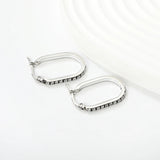 2.26 * 22mm oval-shaped geometric band with white/purple/blue/pink/orange diamonds, ear hooks, steel color asonjewelry