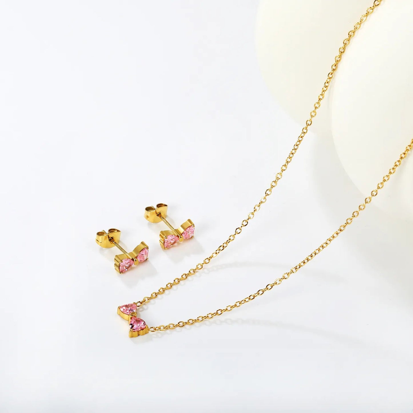 Brogan white diamond/pink diamond stud earrings: 9.3*5mm. Necklace: 9.3*5mm. 0.35 cross chain. 40 + 5cm + 6mm round tail tag. asonjewelry